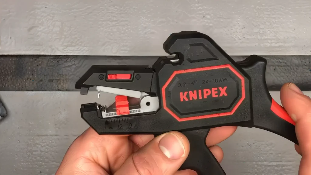 Close-up of KNIPEX 1262180 Wire Stripper - Showing Adjustment Dial and Sharp Blades