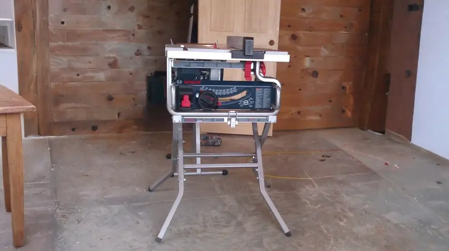 Bosch GTS1031 table saw on its stand in a workshop setting.