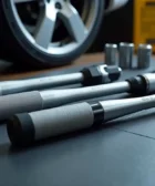 A close-up shot of three different torque wrenches laid out on a table, ready for a test in a workshop for a review of the best torque wrench in 2025.