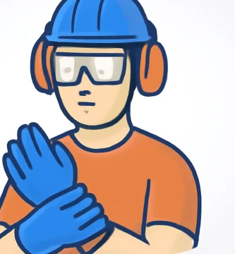 A person wearing a hard hat, safety glasses, hearing protection, and work gloves while working on a DIY projects. This image highlights essential DIY safety tools and is a great visual for the Tool Tested website.