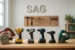 Budget vs Premium Power Tools comparison in a Smart AI Gears workshop, showcasing a mix of tools for various projects.