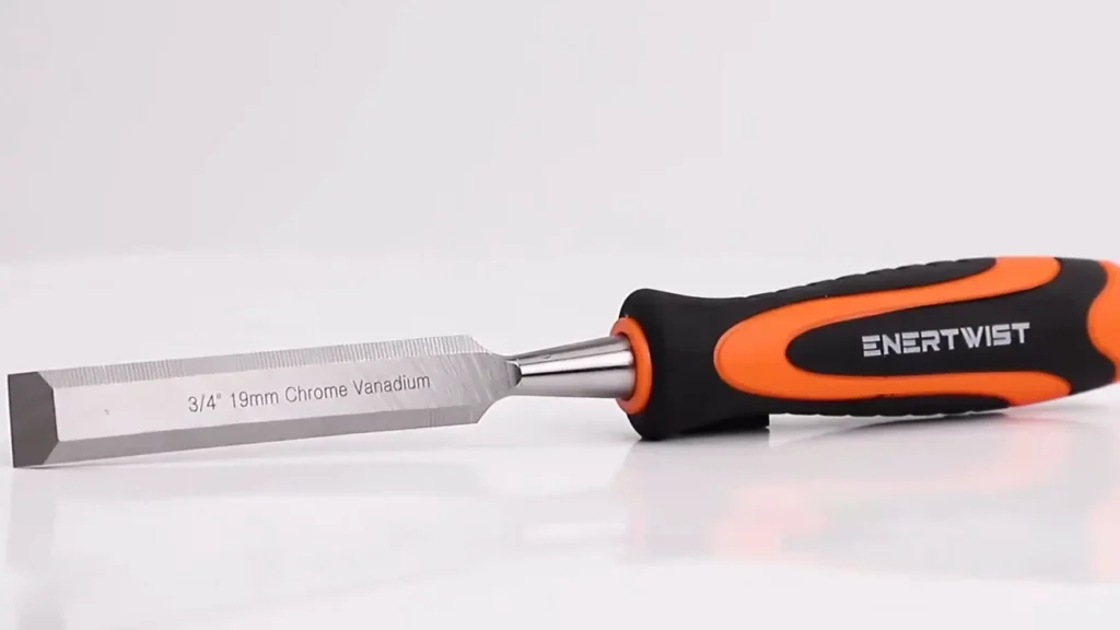 Full view of an ENERTWIST chisel highlighting the polished steel blade and ergonomic handle.