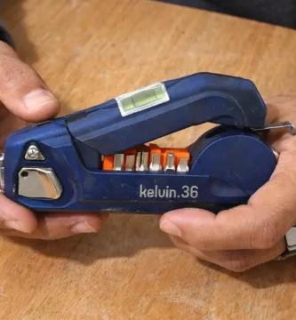 A mobile‑captured photo of the Kelvin 36 Urban Multi‑Tool placed on a wooden table, reviewed for the Kelvin 36 Urban Multi‑Tool Review on Tool Tested.
