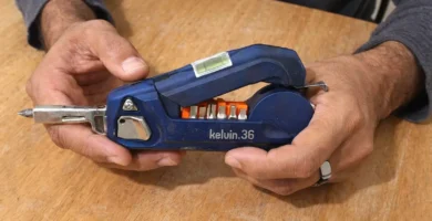 A mobile‑captured photo of the Kelvin 36 Urban Multi‑Tool placed on a wooden table, reviewed for the Kelvin 36 Urban Multi‑Tool Review on Tool Tested.