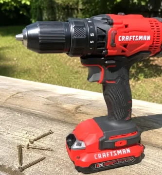 Craftsman CMCD700C1 drill resting on a wooden workbench for a Tool Tested tool review.